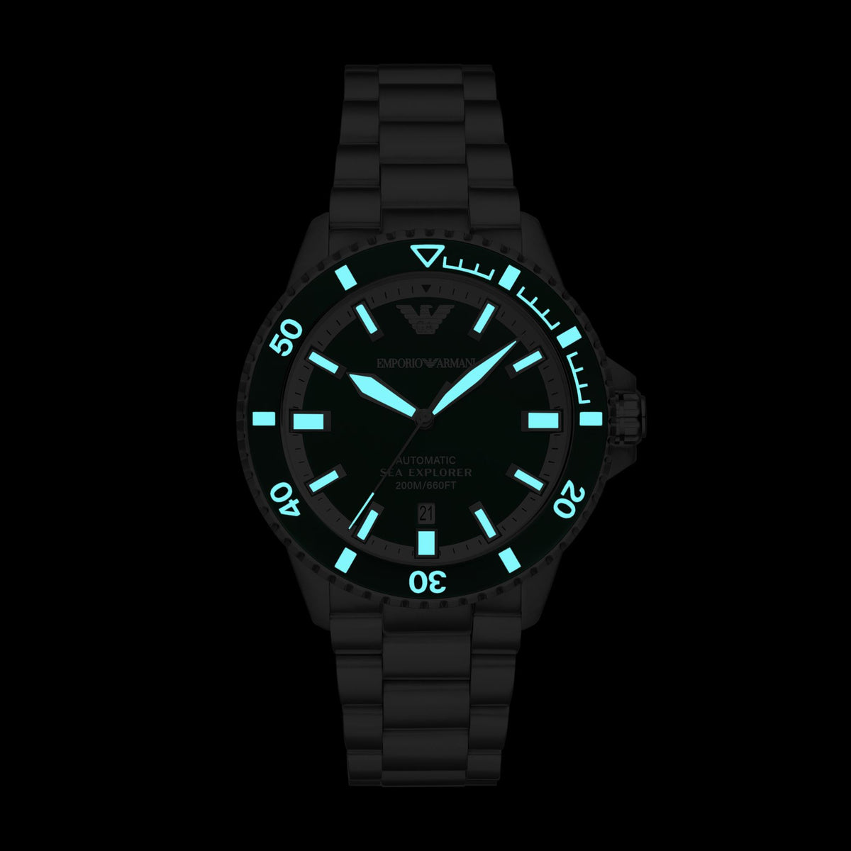 Glowing luminous green dial diver watch with luminous hour markers on steel bracelet