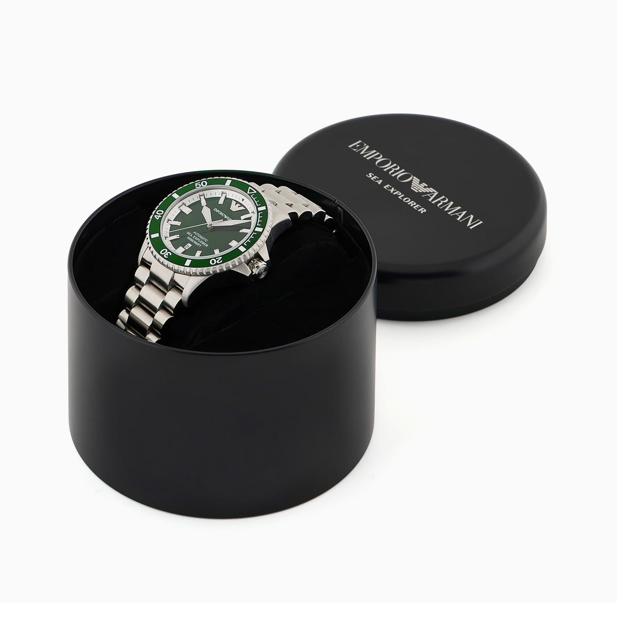 Watch in black round storage box with green dial and stainless steel bracelet