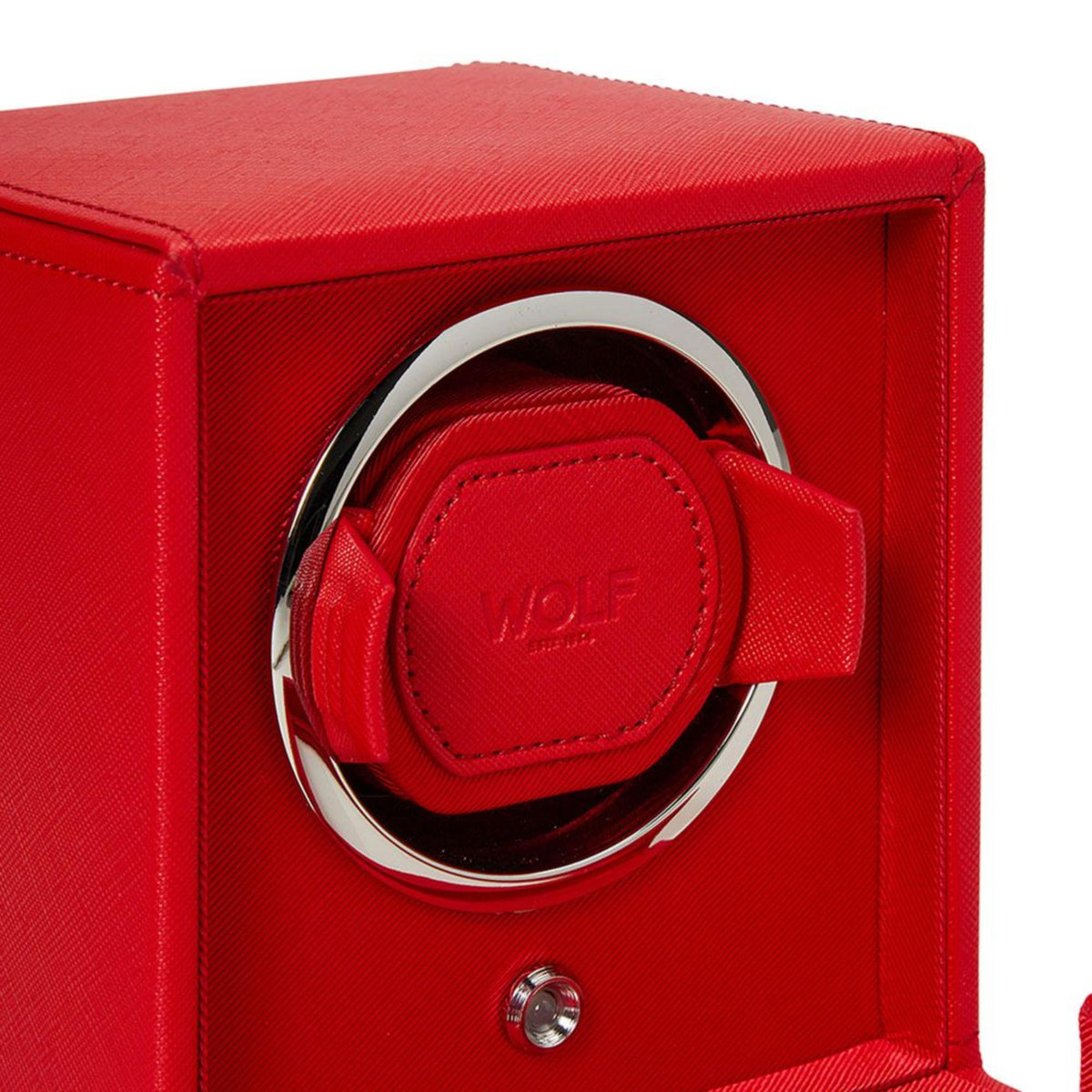 Close-up of red single watch winder with leather cap and chrome rim