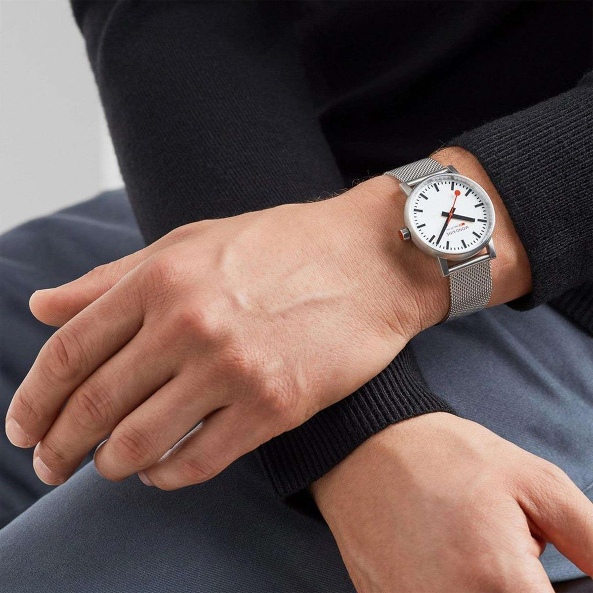 Mondaine Evo2 MSE.35110.SM unisex wristwatch styled on a wrist paired with a dark long-sleeve sweater