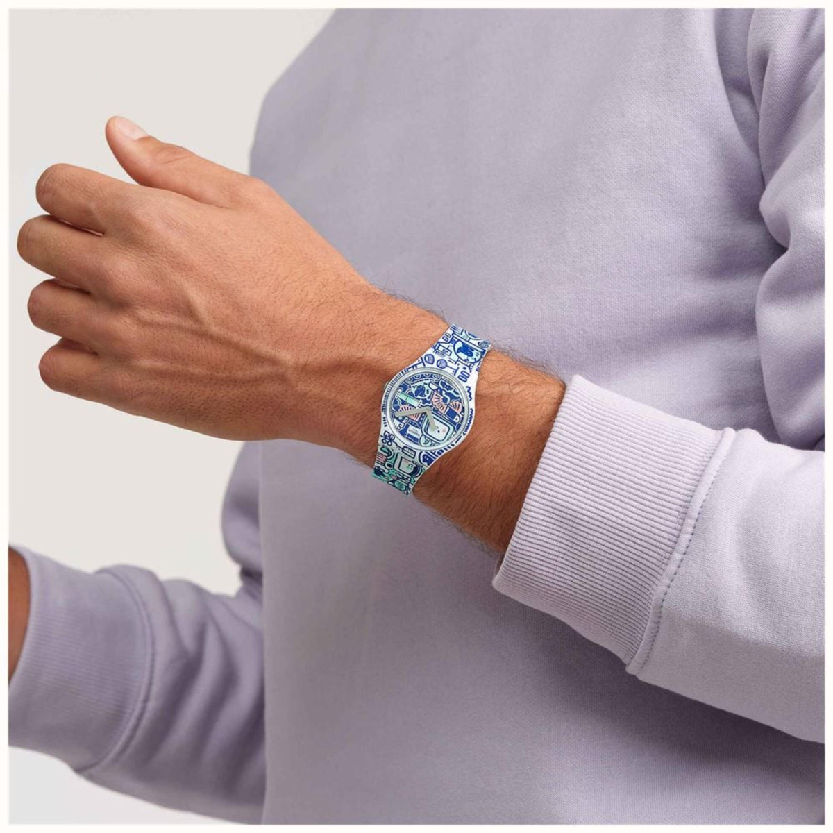 Quartz watch on wrist: blue multi-colour dial with blue silicone printed strap