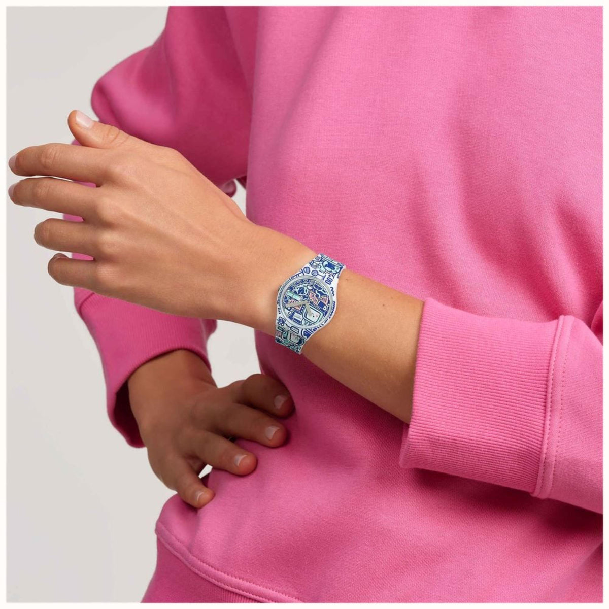 Quartz watch on wrist: blue multi-colour dial and blue silicone printed strap