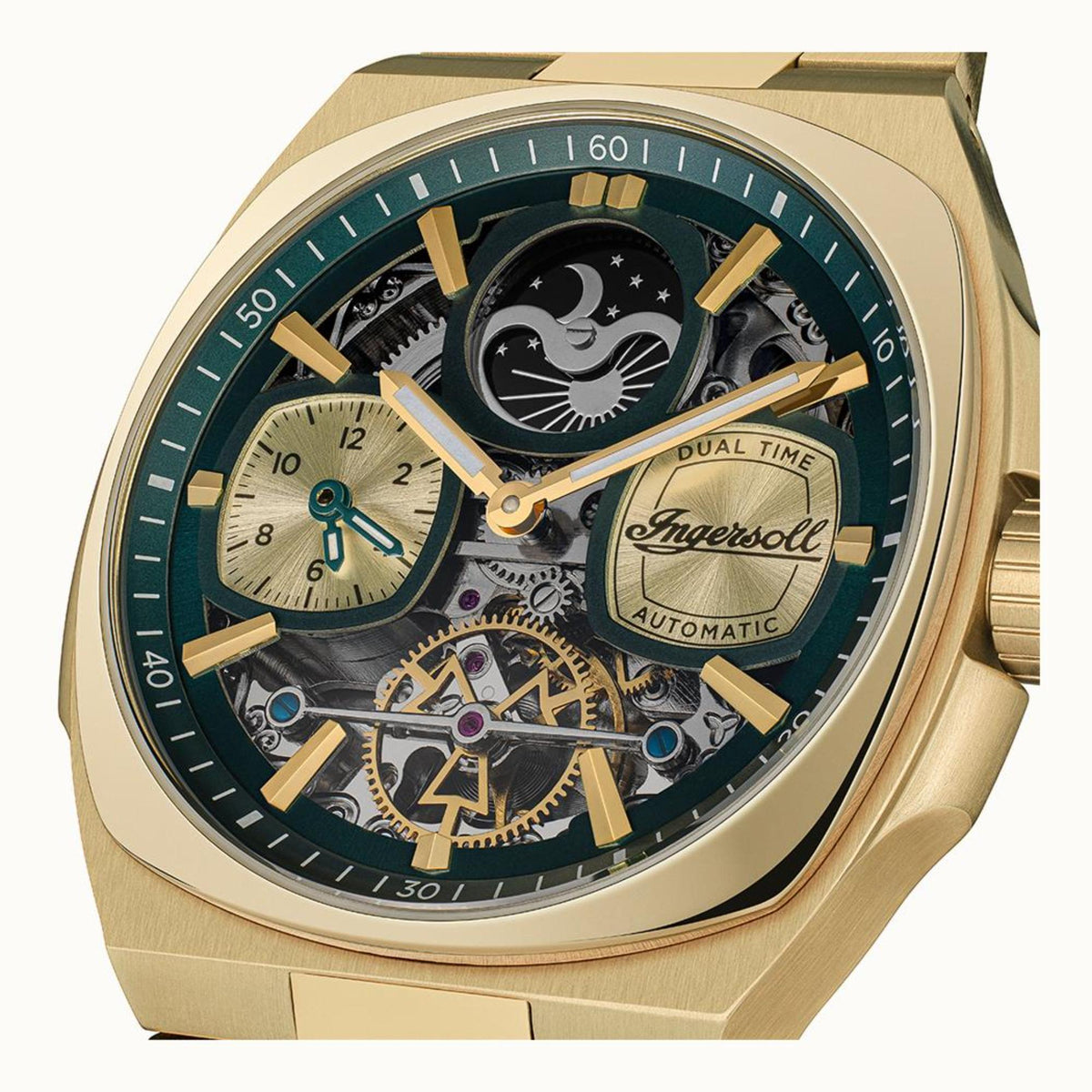 Close-up of teal dial watch with black moonphase disc and gold-toned skeleton hands.