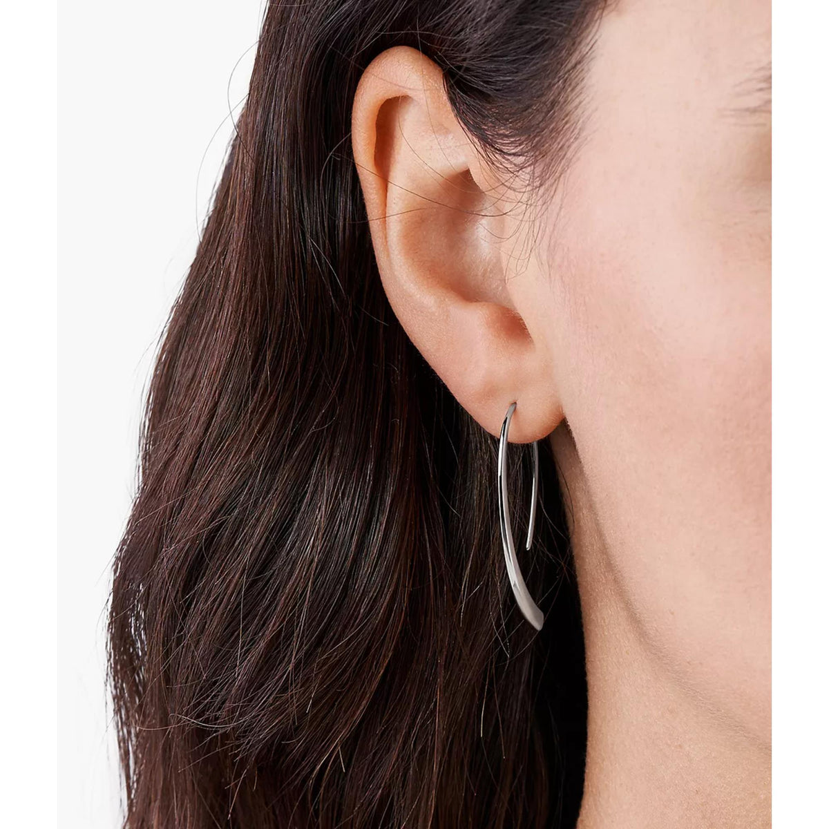 Silver-tone threader earrings on ear, long curved slim hoop with open end