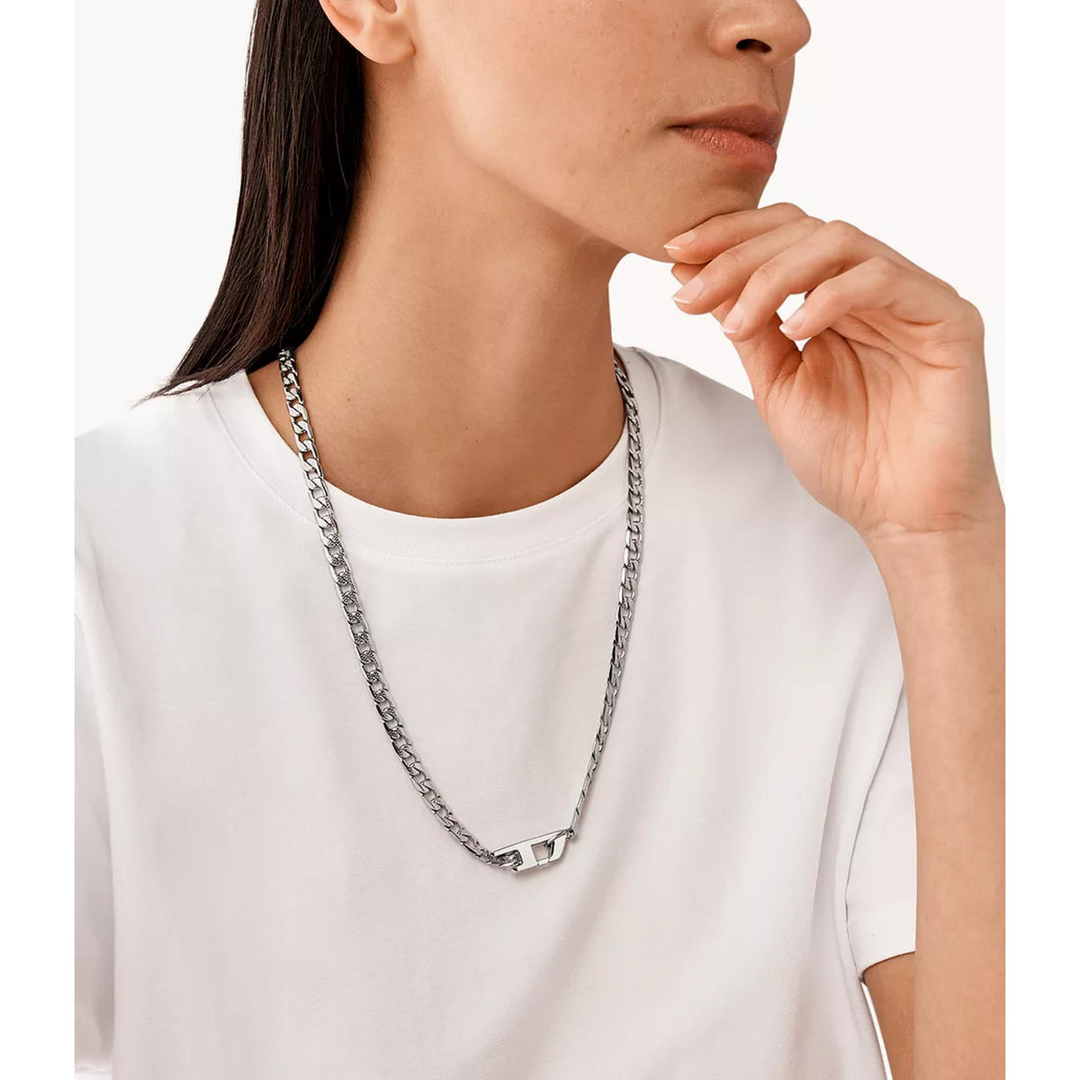 Stainless steel chain necklace with interlocking links on a woman’s neckline