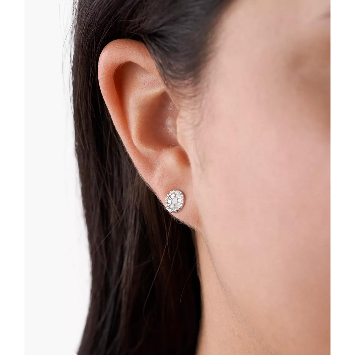 Fossil sterling silver stud earring with mother-of-pearl detail on ear