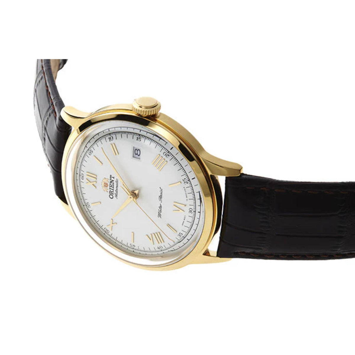 Automatic wristwatch side view with white dial, gold-tone case, brown leather strap