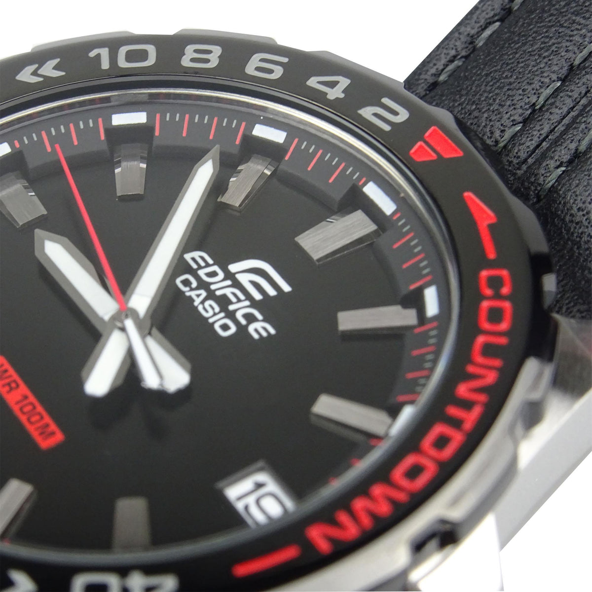Men's quartz watch with black dial, brushed hour markers, red accents, black leather strap