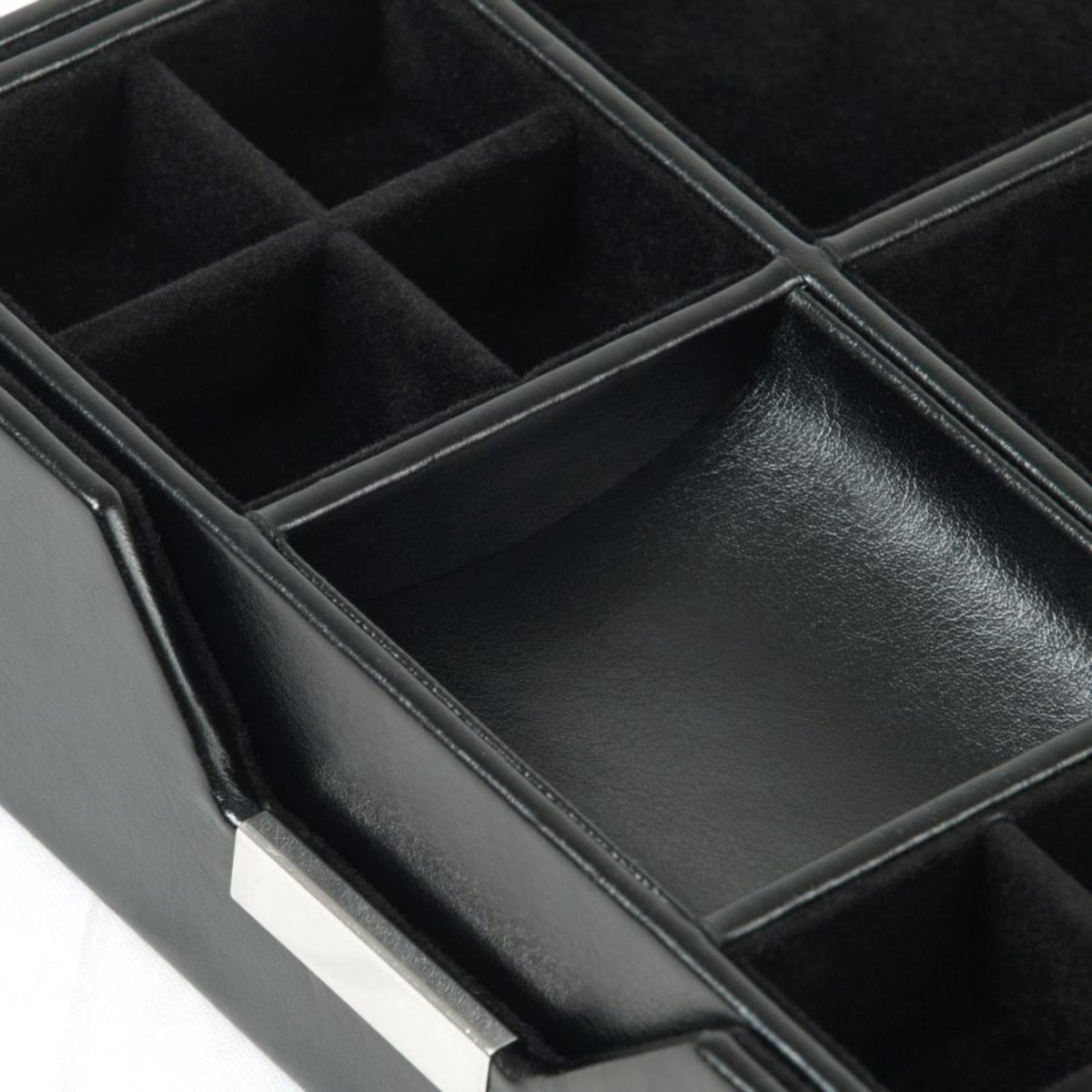 Black leather valet tray with padded sections, stitched dividers, and textured finish