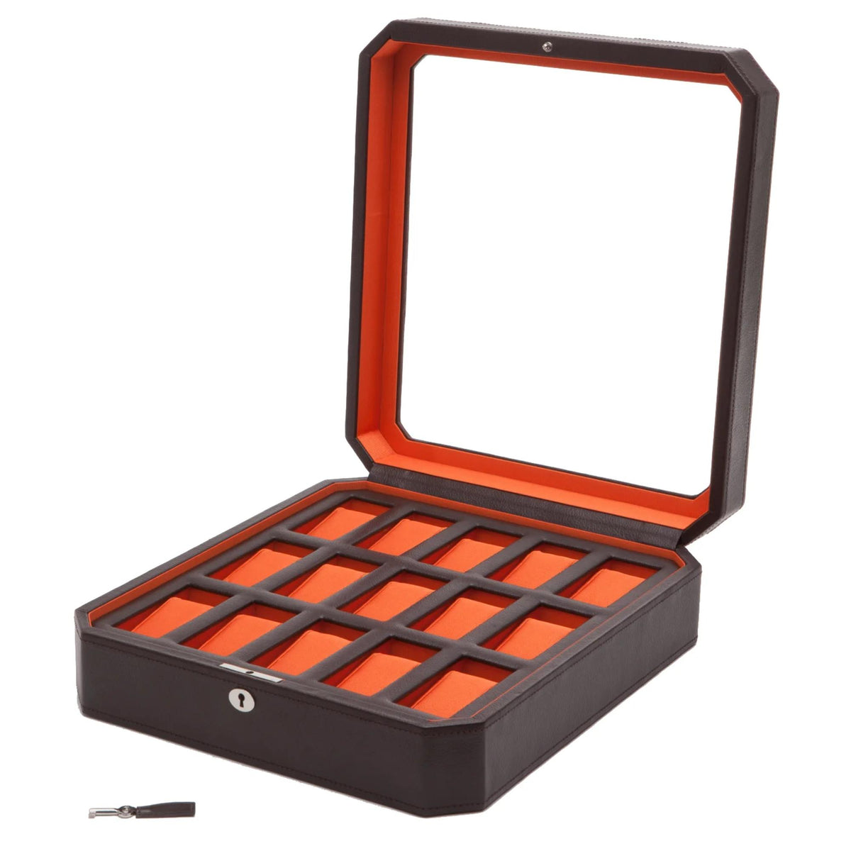 Dark brown watch box with open lid and orange grid compartments; small key included