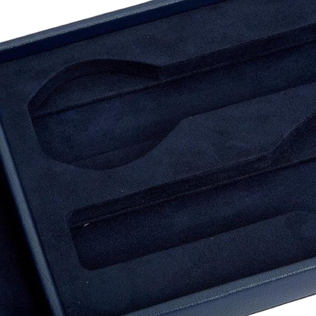 Navy watch box interior with padded watch slots and lid lining
