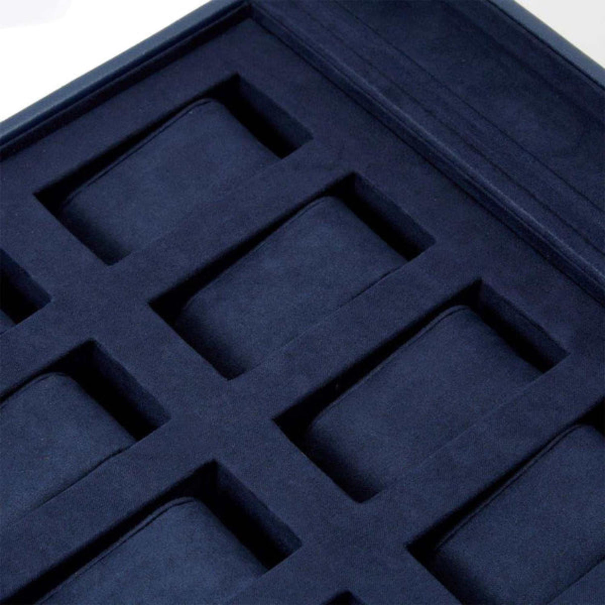 Navy foam insert with fitted watch cushions in a grid layout