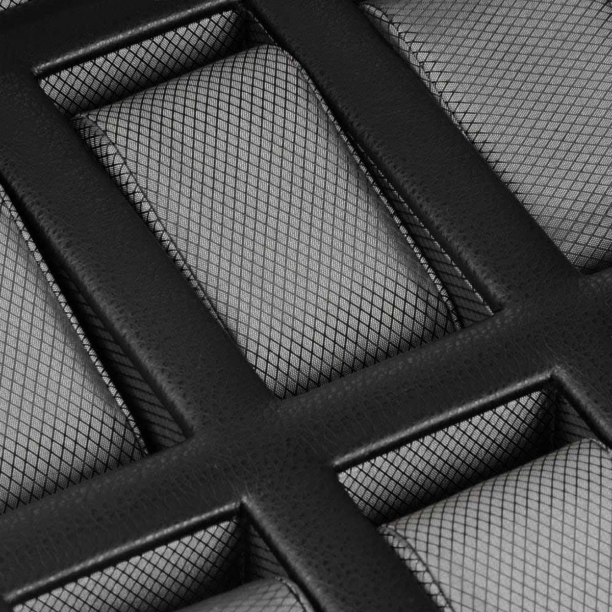 Interior of black watch box with grid-padded slots and textured dividers.