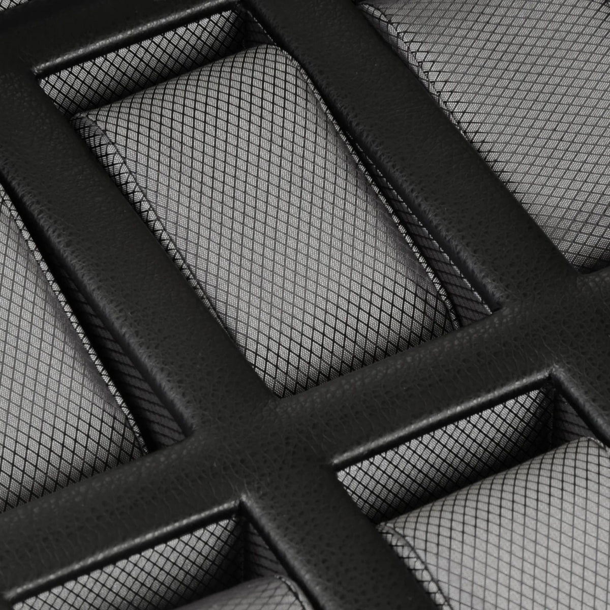 Black watch box interior with padded dividers and textured grid slots
