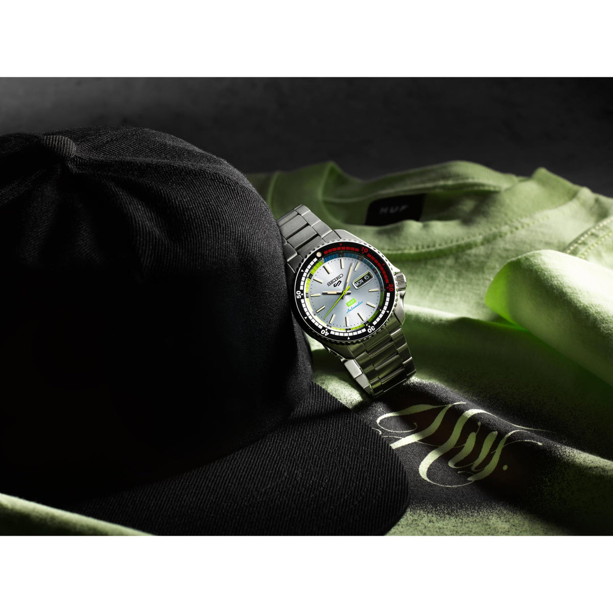 Seiko 5 Sports x HUF SRPL33K1 resting on apparel lifestyle view