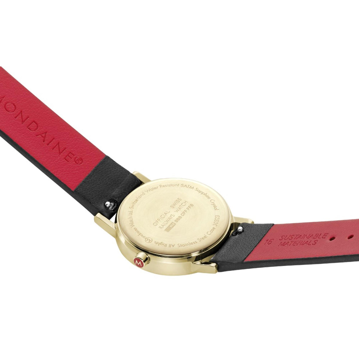 Mondaine watch case back with black leather strap and red lining, gold-tone finish