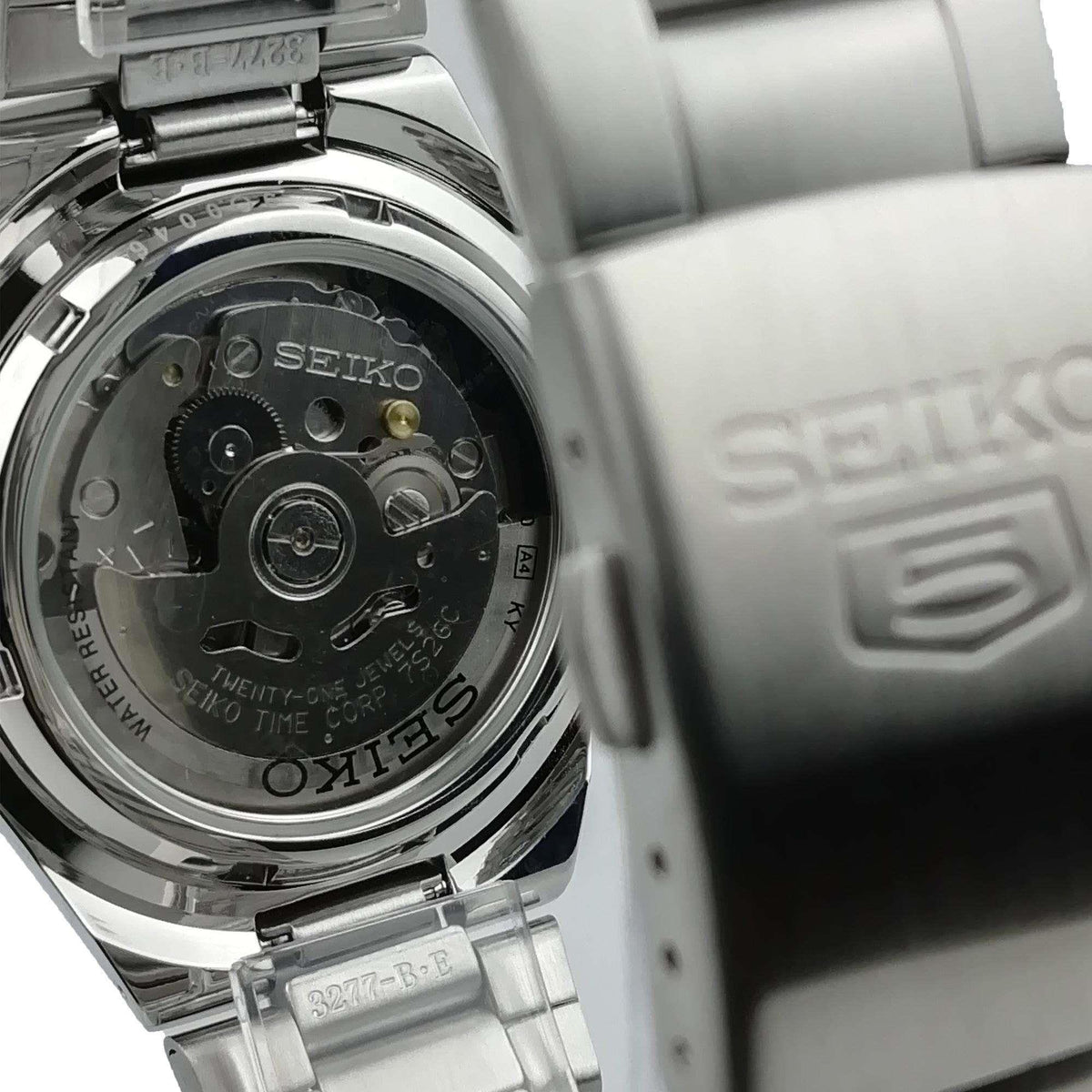 Rear view of Seiko 5 SNK601K1 mens automatic watch revealing the transparent exhibition case back and movement