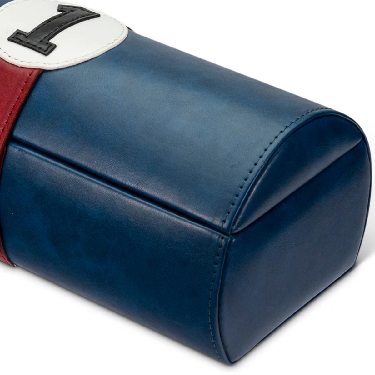 Navy blue watch case pouch with stitched leather look and red side panel detail.