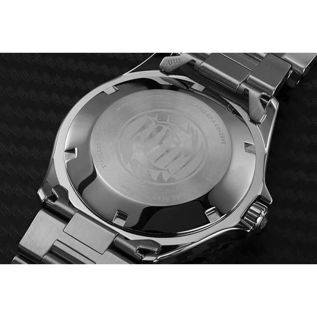 Stainless steel caseback with engraved Orient logo and diver emblem