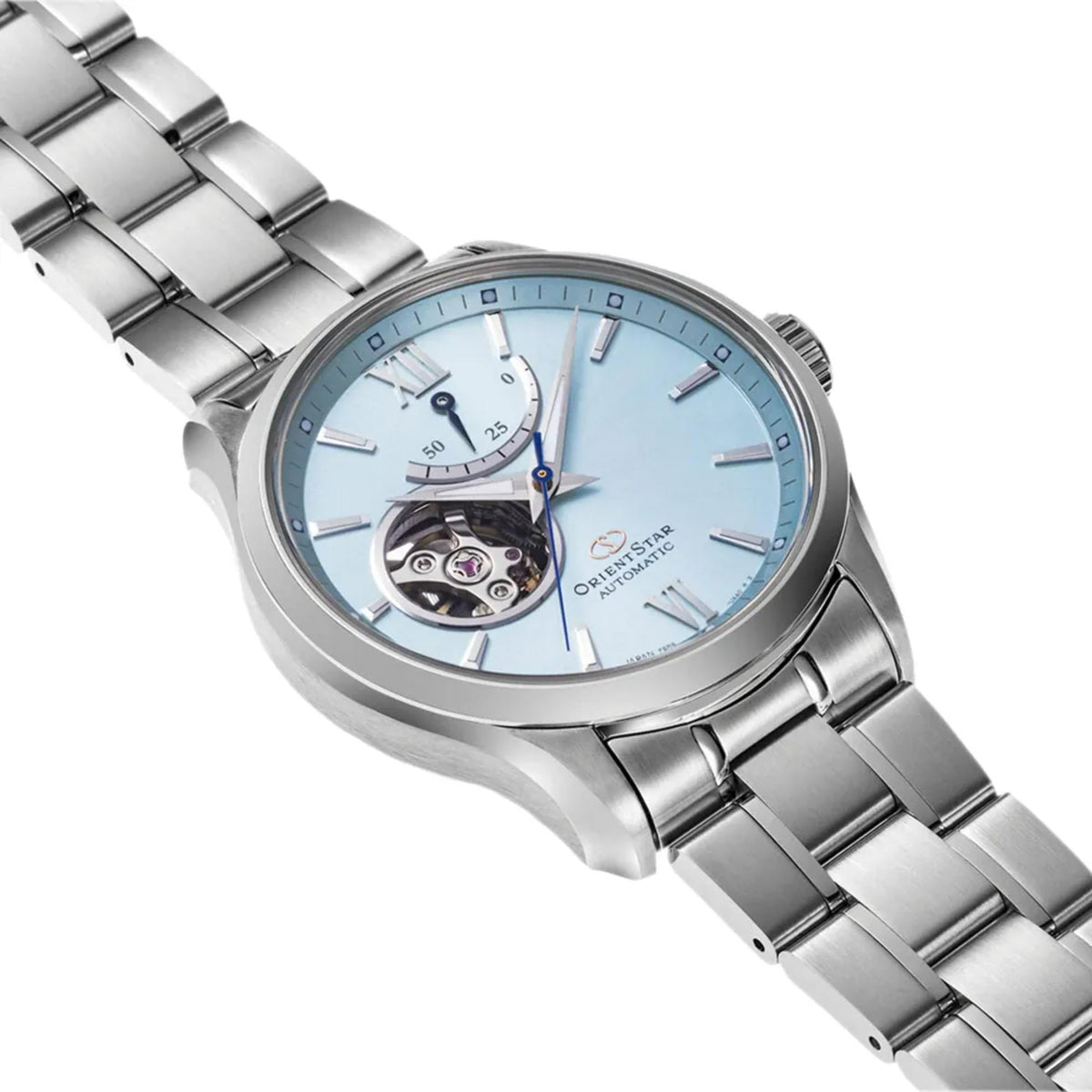 Stainless steel automatic watch with blue dial and visible movement under glass