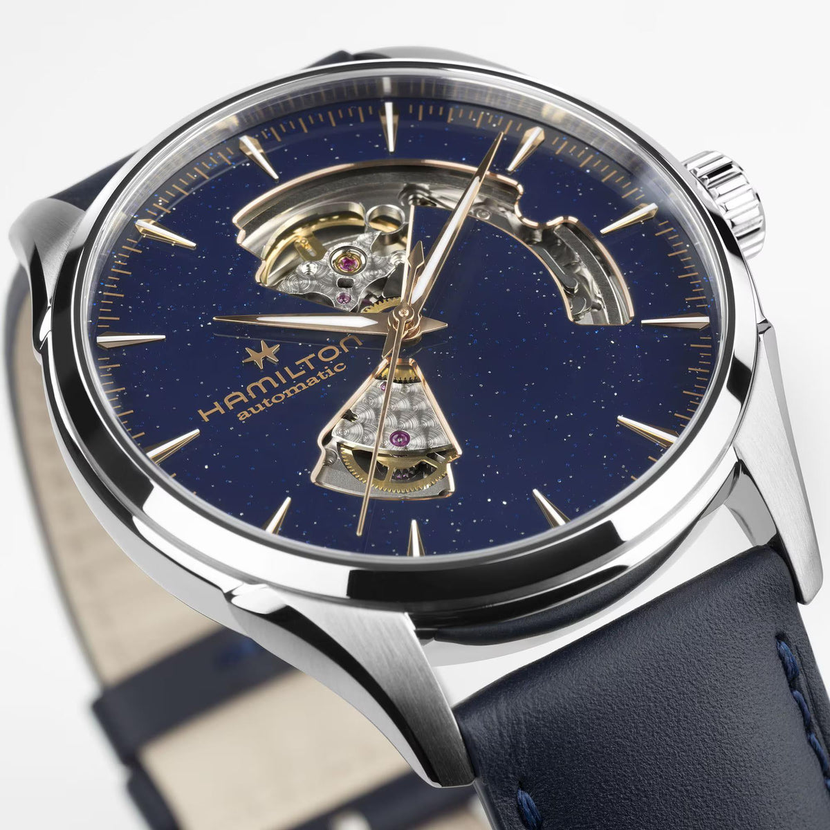 Hamilton Jazzmaster H32705640 automatic timepiece angled close-up showing stainless steel bezel and rose gold hour markers