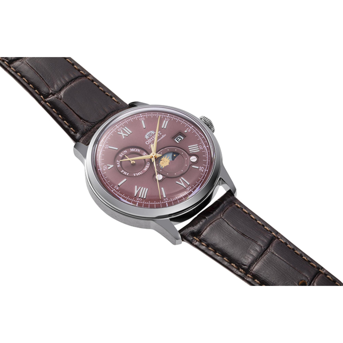 Diagonal perspective of Orient Bambino RA-AK0807R30B mens watch showcasing the red dial and leather strap