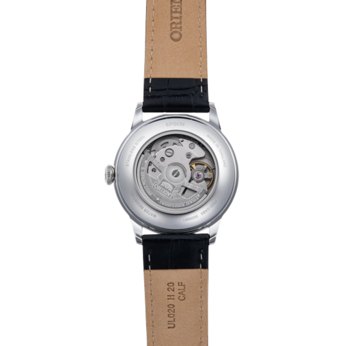 Orient Bambino automatic watch caseback, visible mechanism, black strap with tan backing