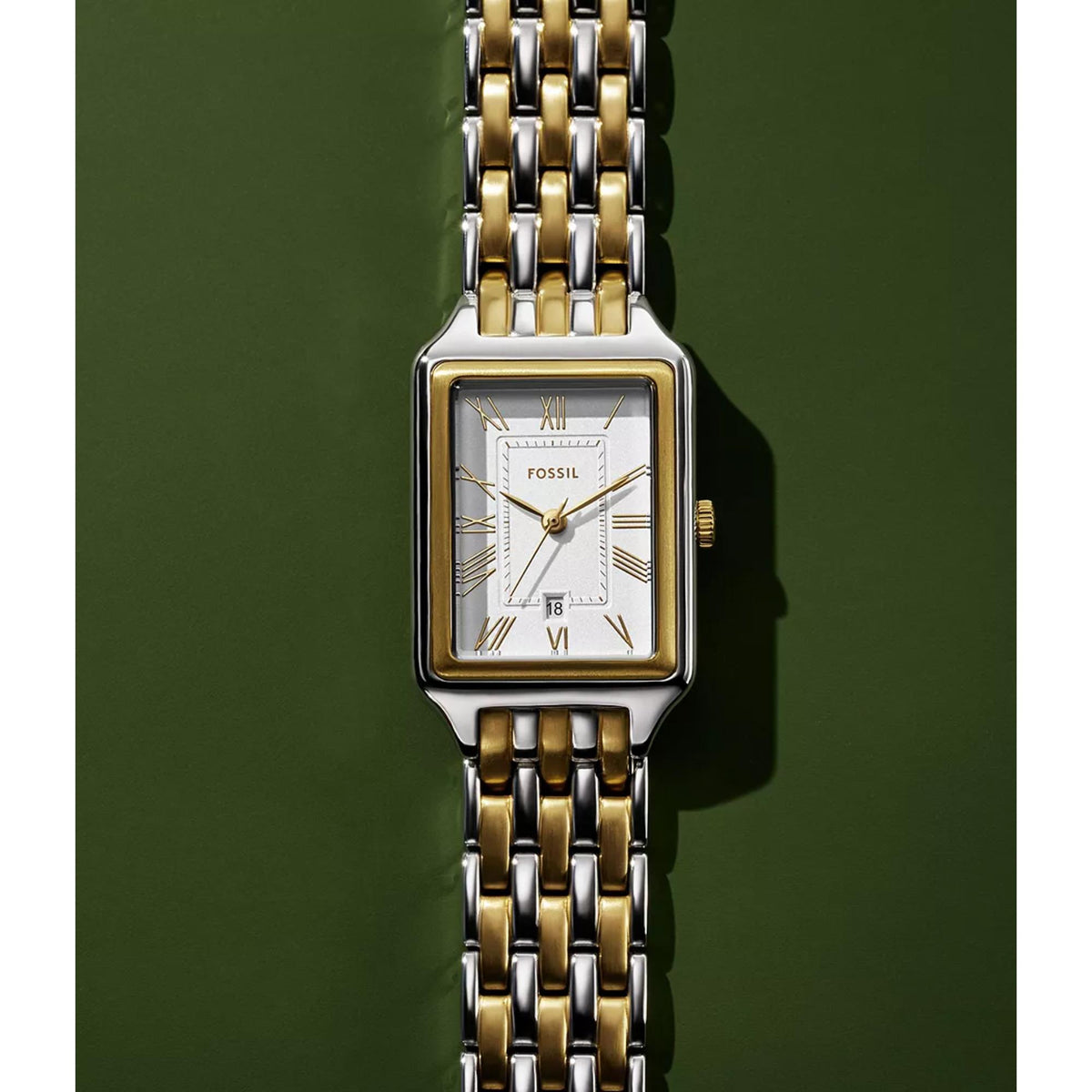 Front studio view of the Fossil Raquel ES5368 quartz watch featuring a rectangular silver dial and gold-tone hands