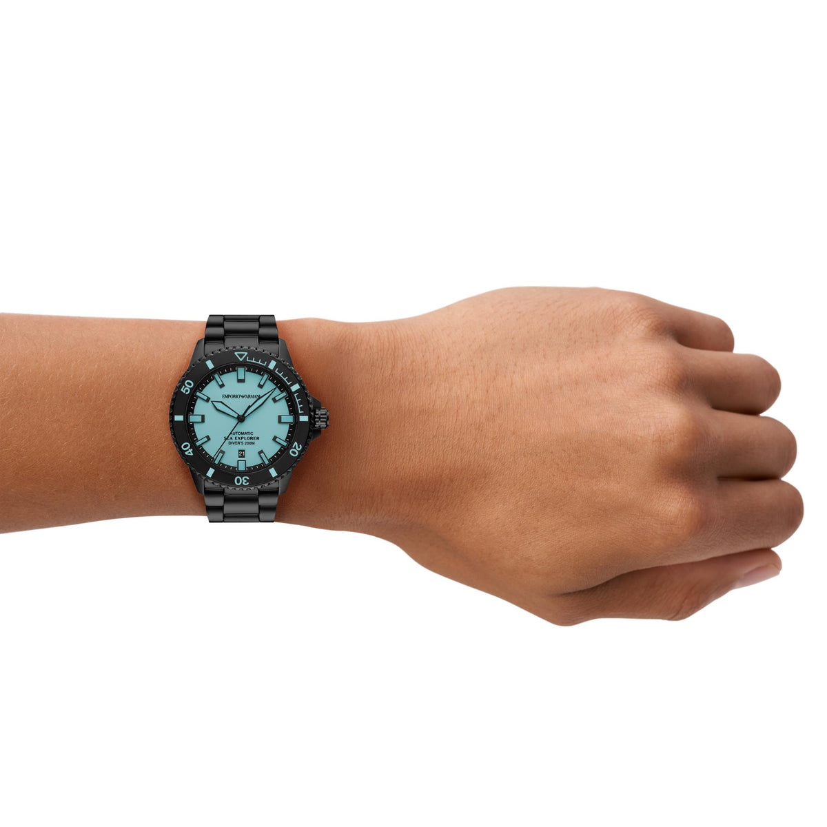 Close-up of the Emporio Armani Sea Explorer AR60084 watch on wrist featuring a blue dial and black dive bezel