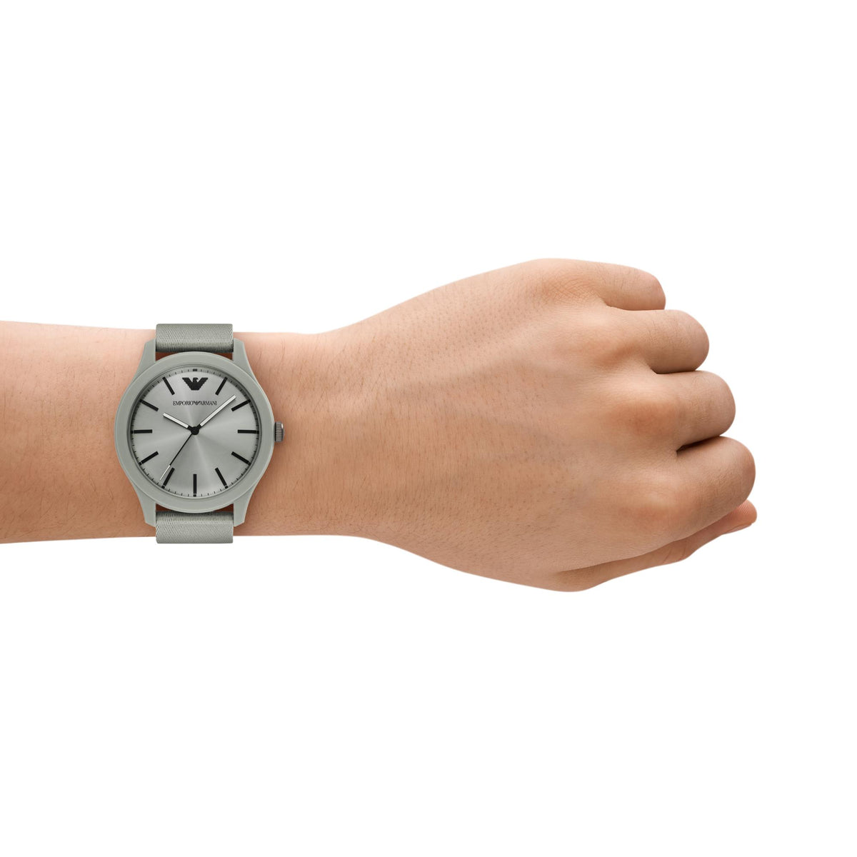 Men's gray dial quartz watch worn on wrist with gray fabric strap