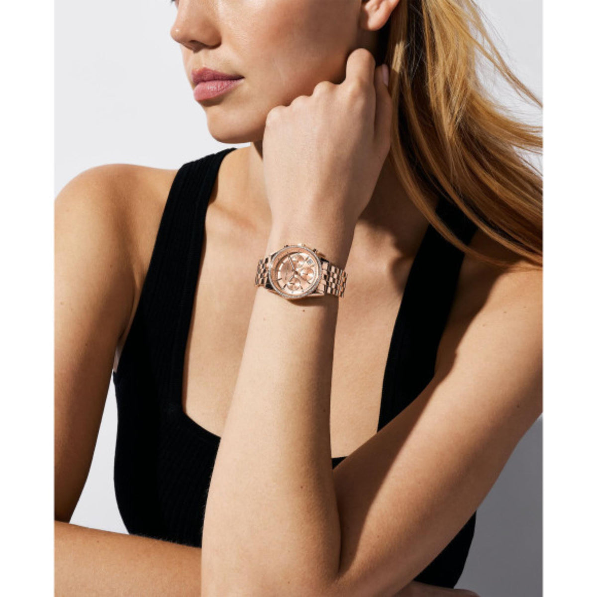 Michael Kors Mini Bryant MK7531 ladies chronograph model shot view showing the rose gold tone timepiece on a wrist