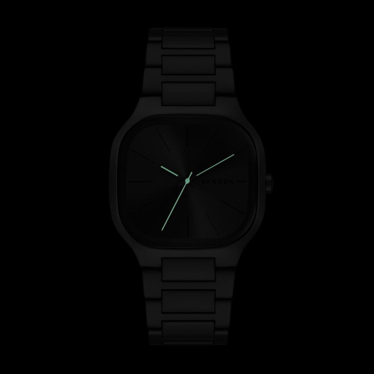 Dark view demonstrating the glowing luminous hands of the Skagen Mellem SKW6936 watch on a grey dial background