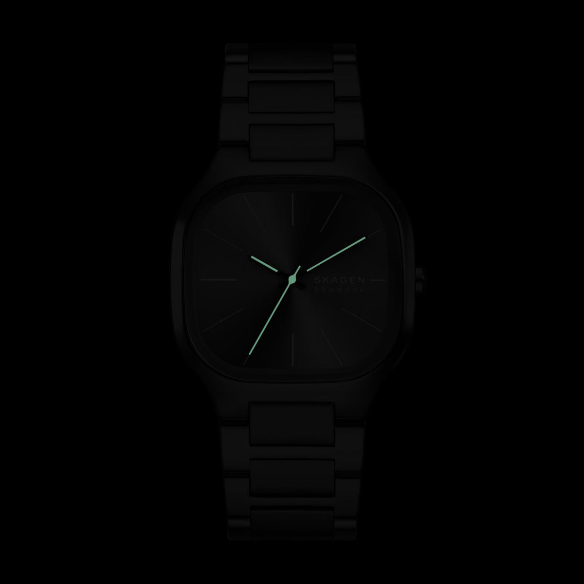 Darkened view displaying the glowing luminous hands against the black dial of the Skagen Mellem SKW6935 watch