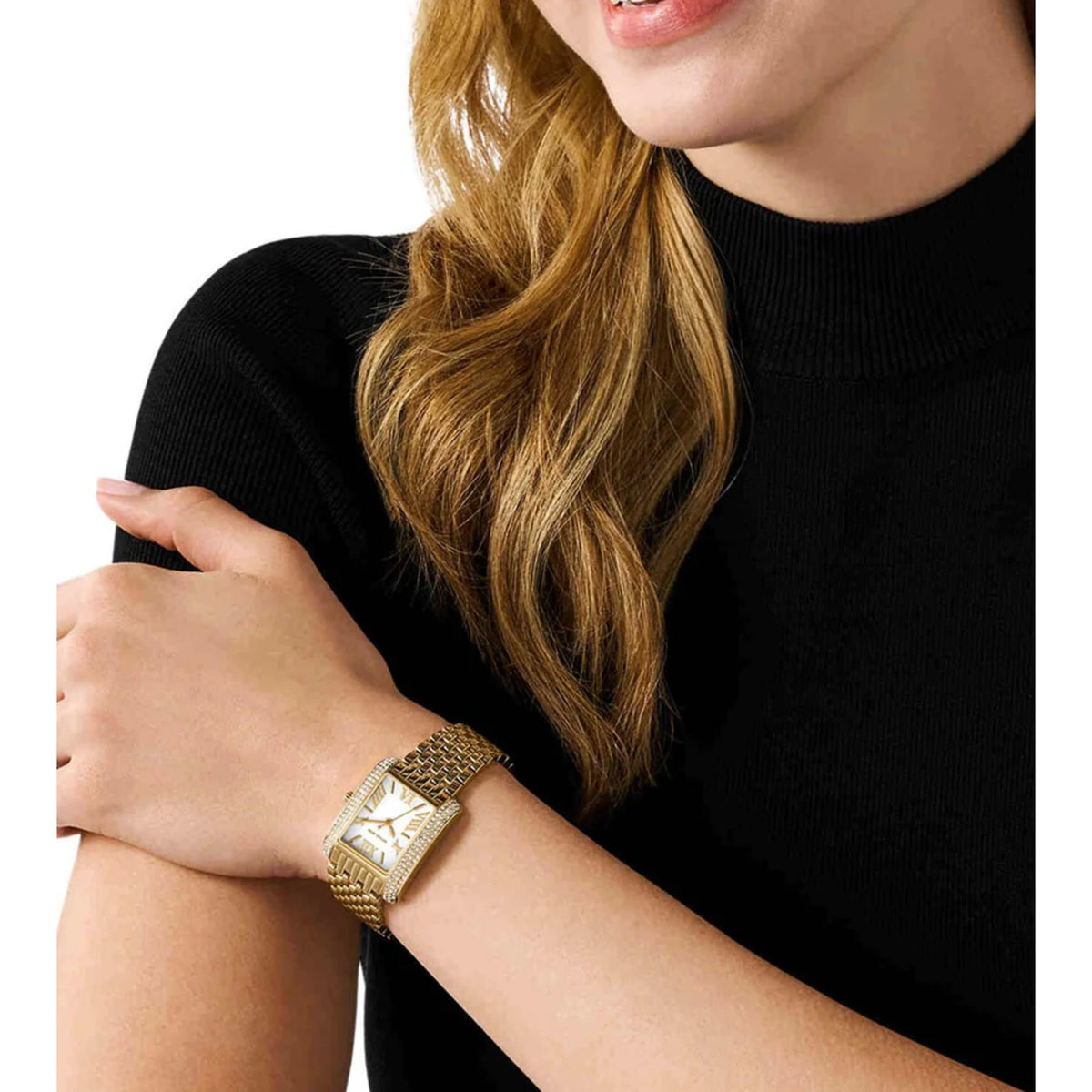 Gold-tone ladies wristwatch with white dial and jeweled bezel on metal link bracelet