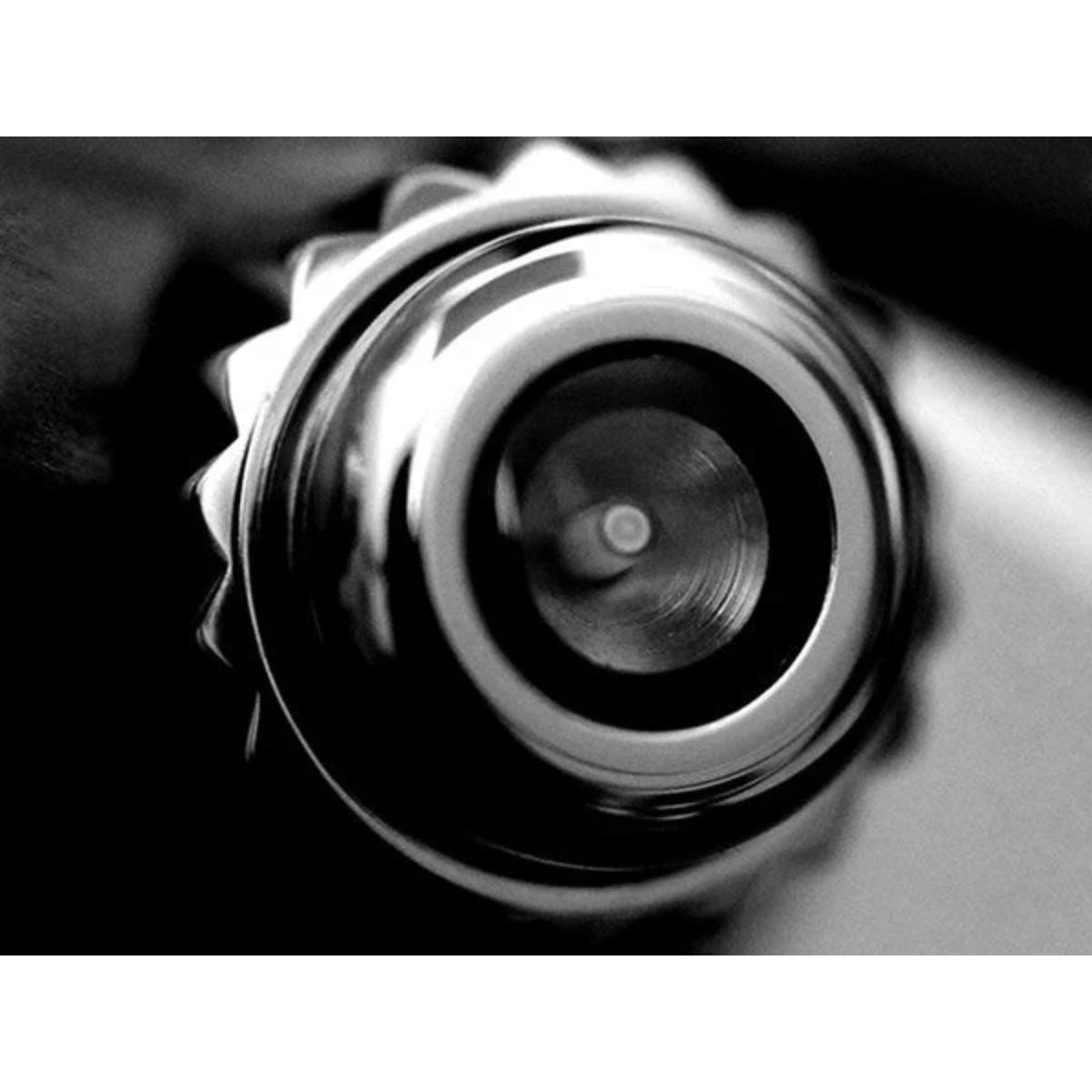 Stainless steel watch case side with crown and textured bezel detail