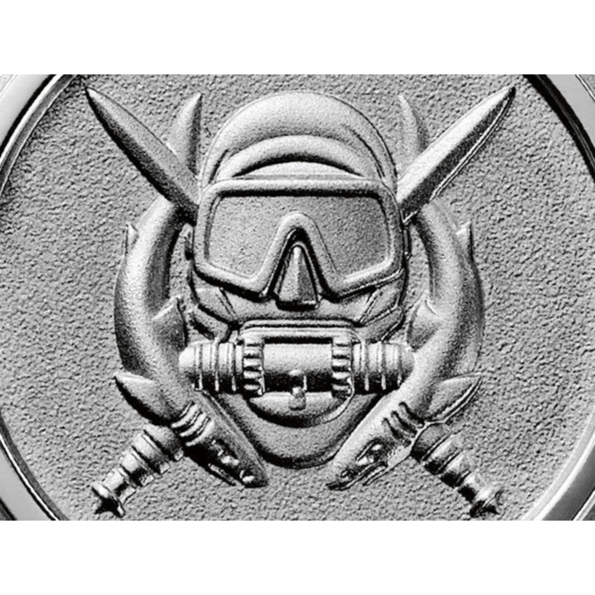 Engraved astronaut-style emblem on watch case bezel in silver tone