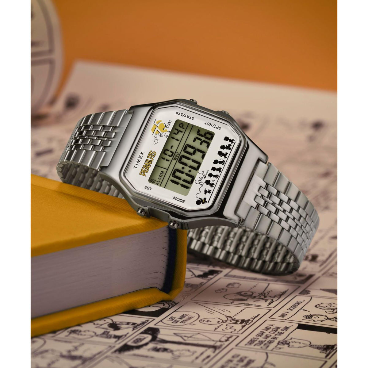 Silver digital quartz watch with green display, Snoopy graphics, and metal bracelet