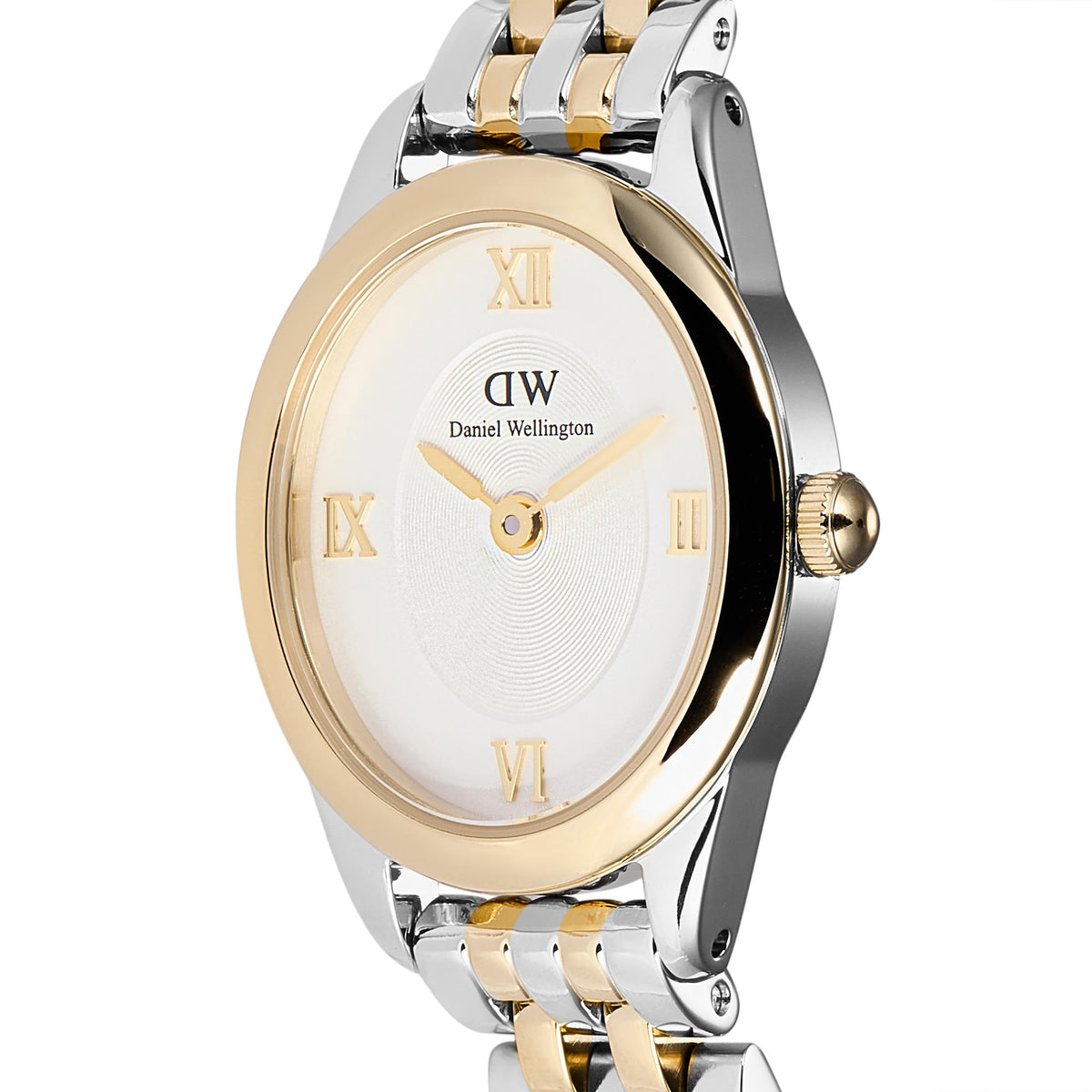 Close-up of white watch dial with Roman numerals and gold-tone hour markers