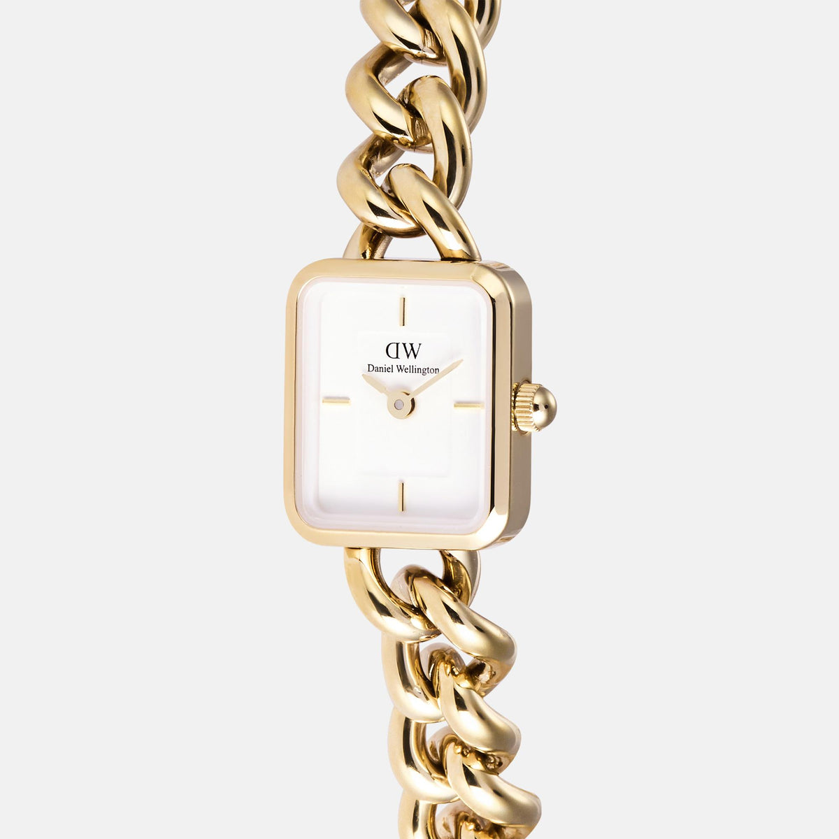 Close-up gold-tone square quartz watch with white dial, hands, and crown on link bracelet