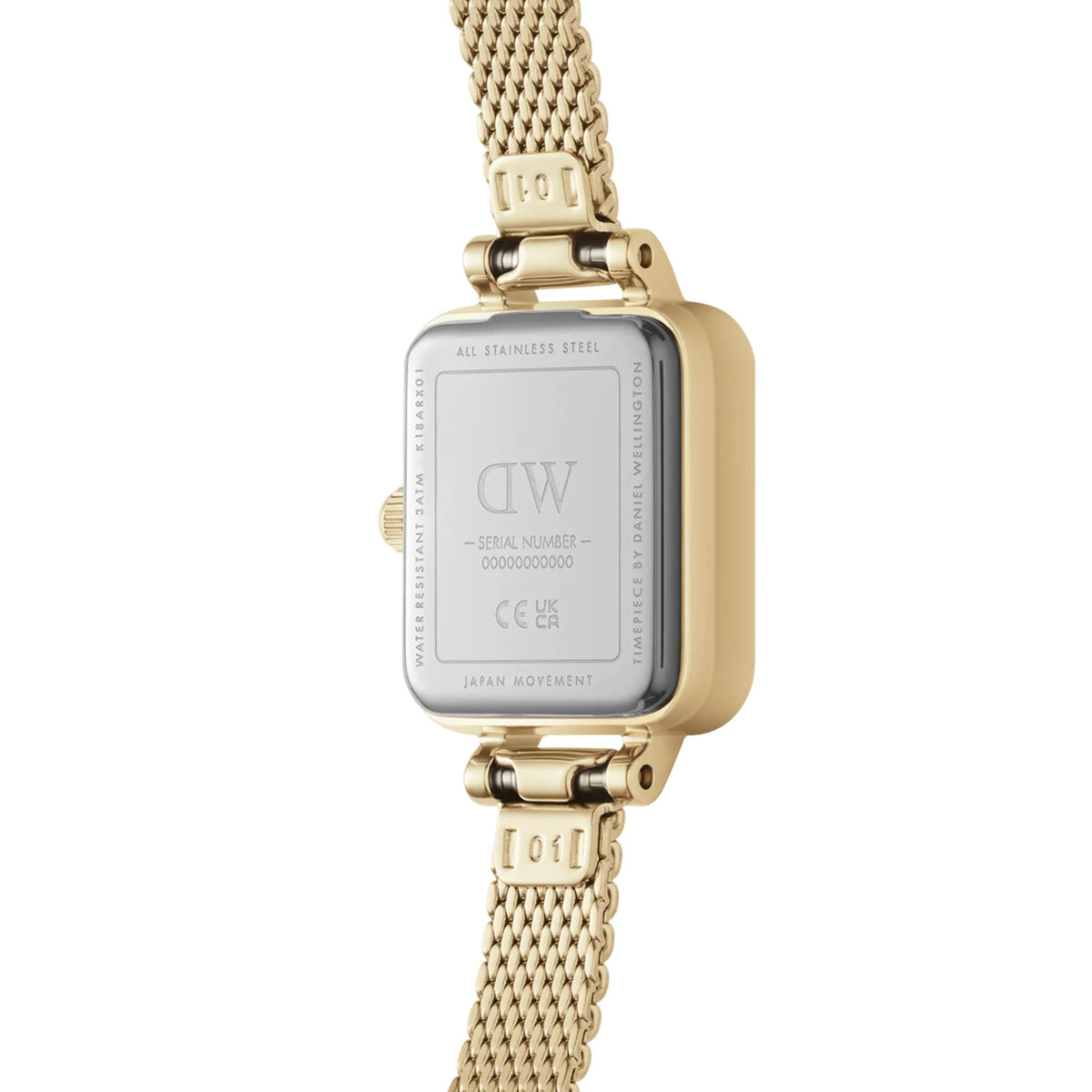Daniel Wellington Quadro watch case back with engraved details and gold mesh strap
