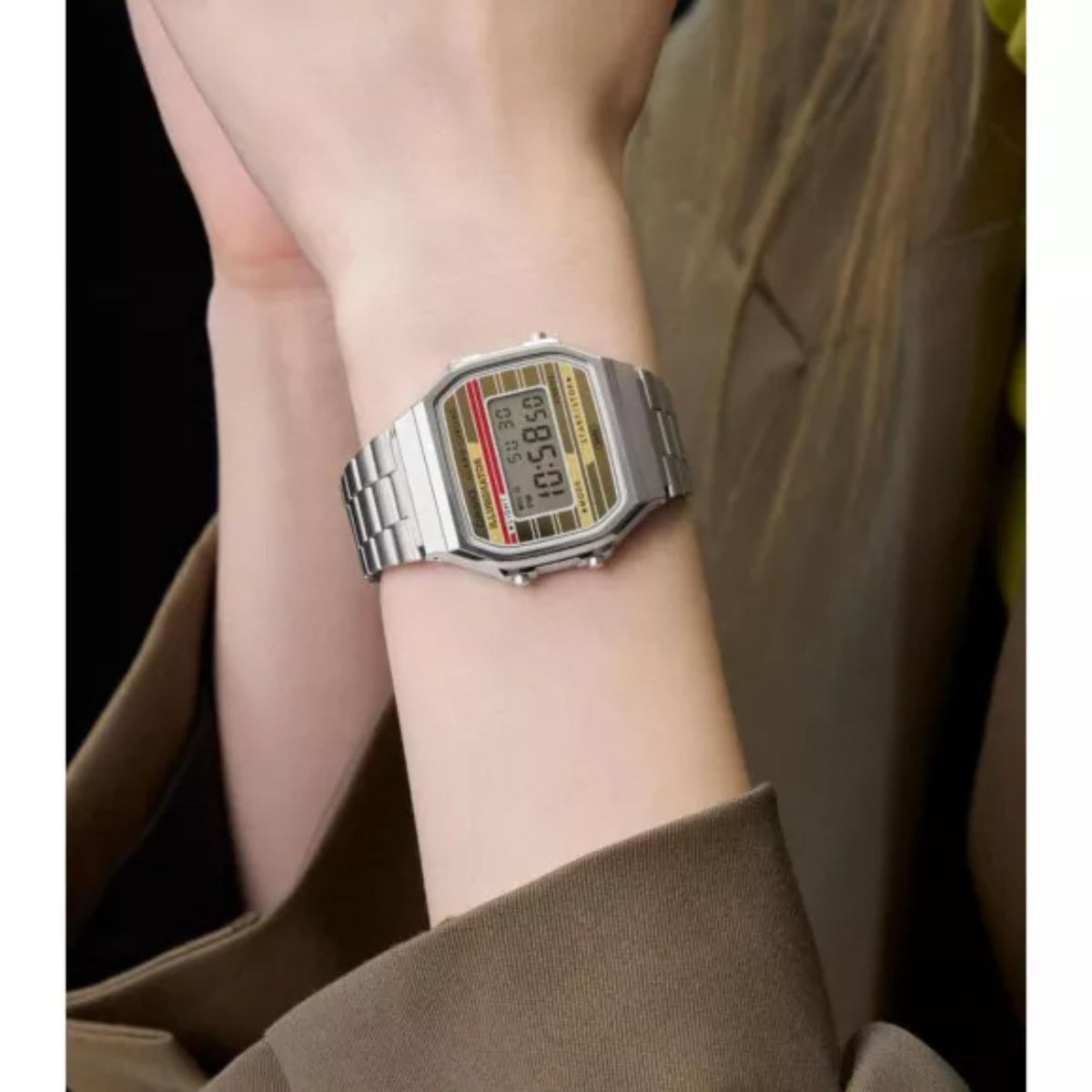 On-wrist lifestyle view of the Casio Vintage Digital steel bracelet watch A168WEHA-9AEF paired with a neutral blazer