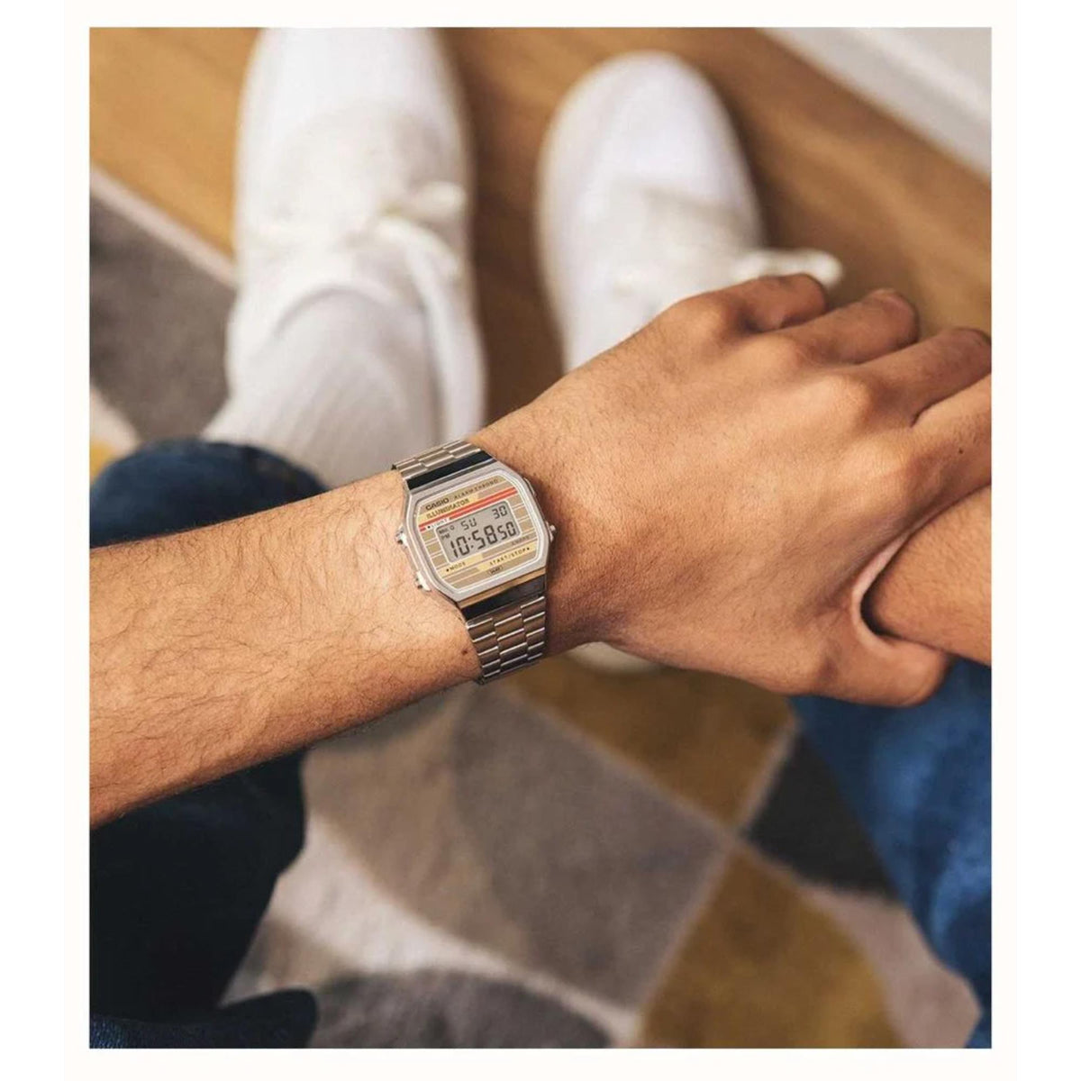 Overhead wrist shot of the Casio Vintage watch A168WEHA-9AEF worn casually with jeans