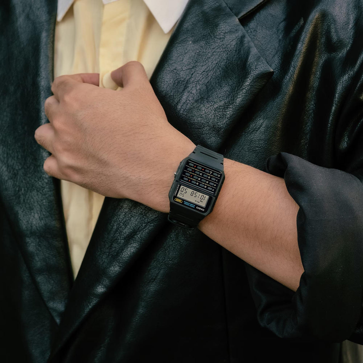 Casio Vintage CA-53W-1ER black digital quartz watch styled on a wrist under a leather jacket