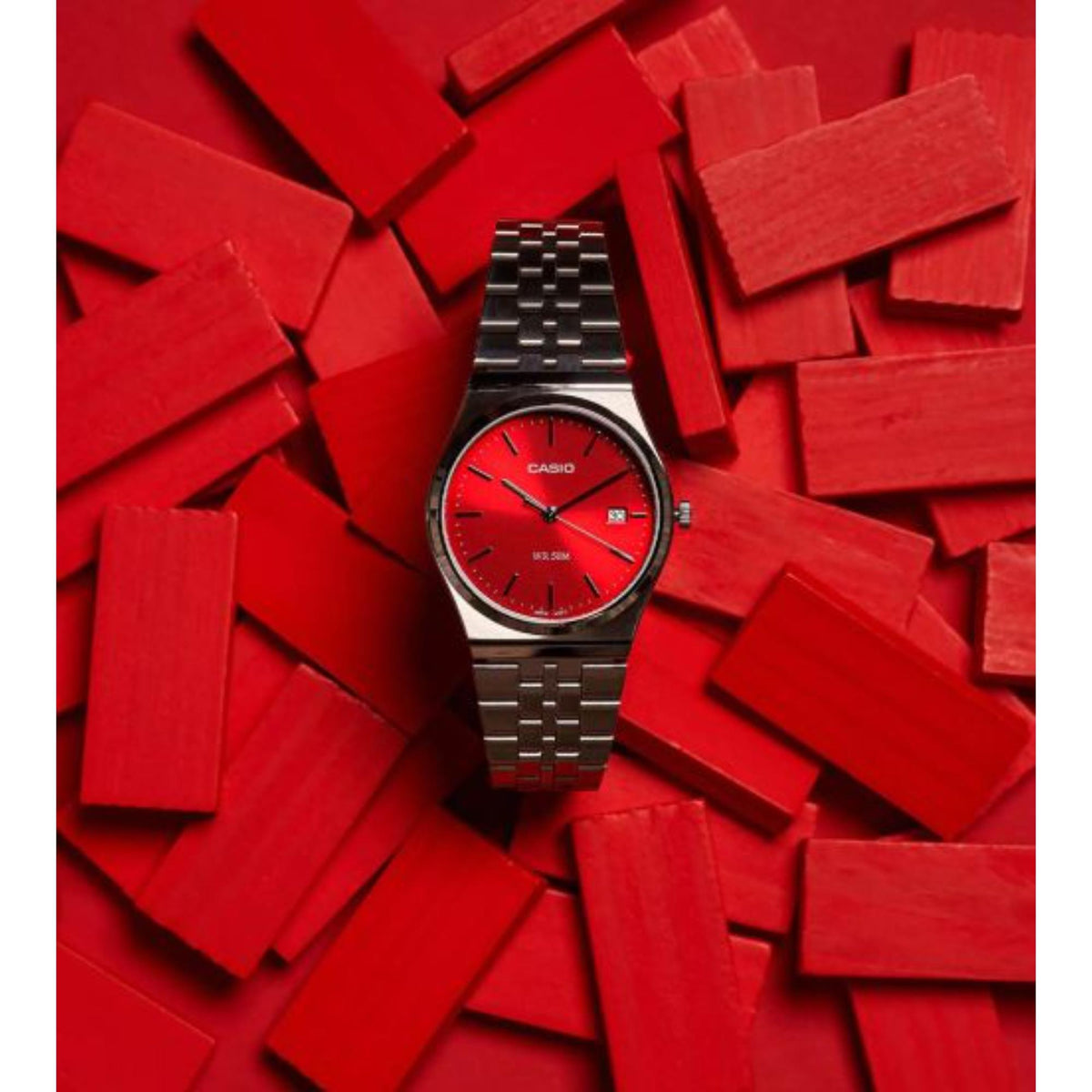 Red dial men's watch with black metal link bracelet, silver case, baton hour markers