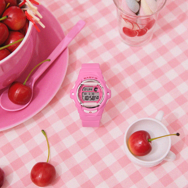 Pink Casio BABY-G digital watch with resin strap, LCD face at an angle.