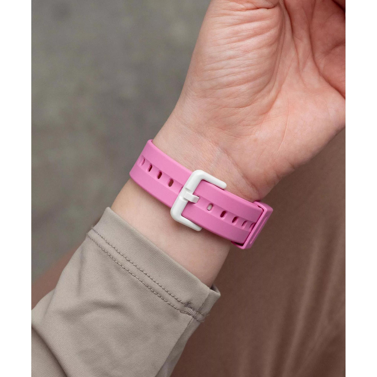 Pink Casio BABY-G resin strap watch with metal buckle on wrist.