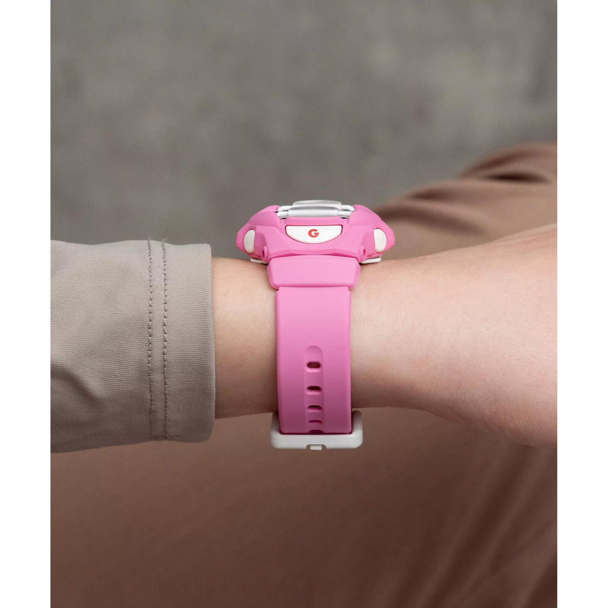 Pink Casio BABY-G digital watch side view with resin strap and clasp.
