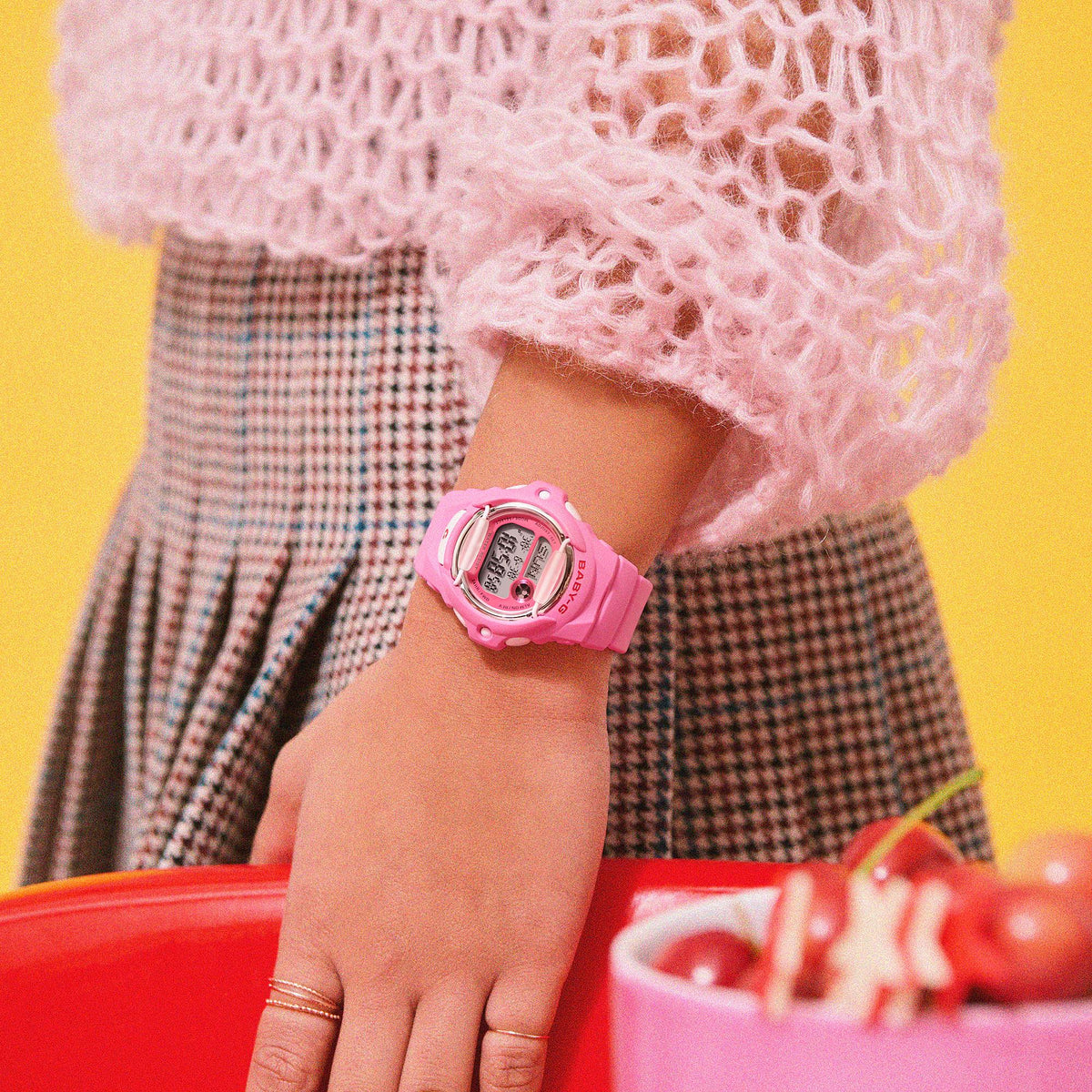 Pink resin-strap digital watch with BABY-G face detail on an arm.