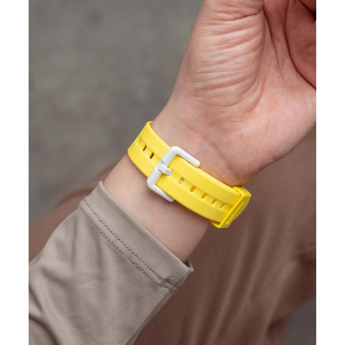 Close-up shot of the white pin buckle closure on the Casio Baby-G BG-169CH-9ER yellow watch strap