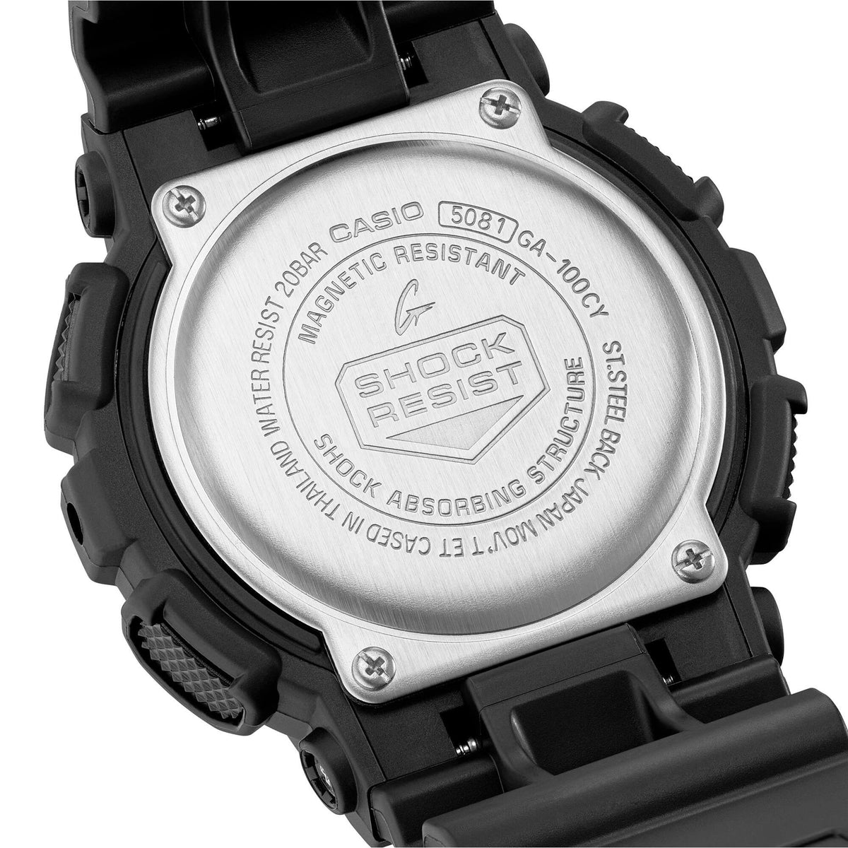 Back of black G-Shock watch case with engraved metal plate and screw details.